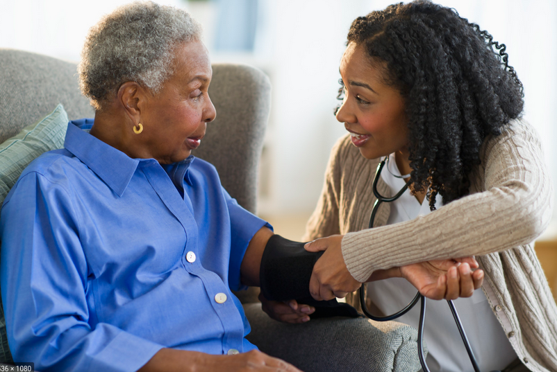 Friendly staff member assisting resident